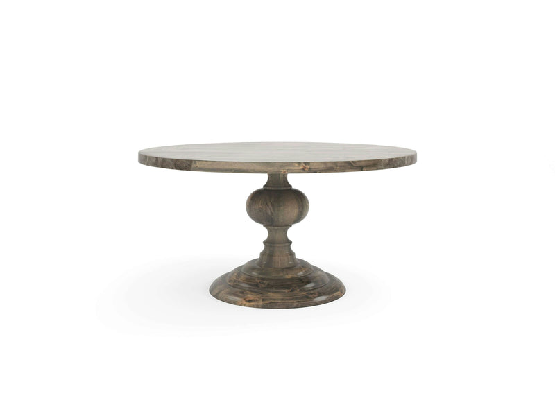 The Josephine Round Dining Table - Deep Grey by James+James features a single, thick pedestal base with a spherical decorative element in the center and a wide, circular base for stability. The table has a rustic finish and is displayed on a plain white background.