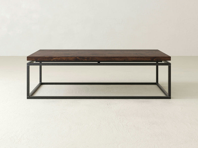 The James+James Floating Top Coffee Table boasts a solid hardwood top and an industrial metal base, presented in a minimalist rectangular design that exudes a simple and modern aesthetic.