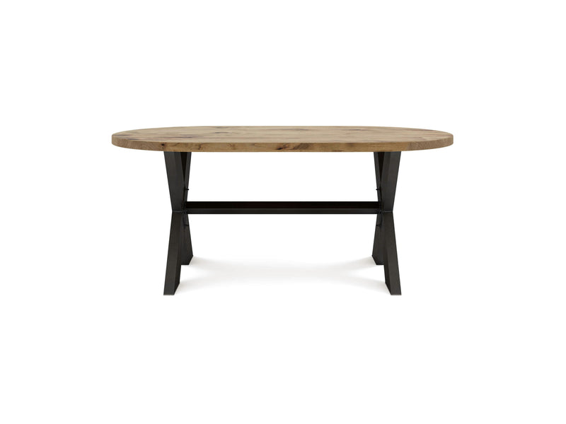 The James+James X-Base Oval Dining Table - Harvest Wheat features a light-colored top and dark, angled legs set against a white background. This wooden table boasts a simple, modern design with a crossbar connecting the legs for added stability.