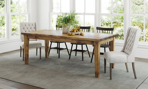 Pictured at 7’ L x 37" W in Harvest Wheat Finish. Pictured with <a href="/products/off-white-linen-lauren-tufted-linen-chair">Off White Lauren Tufted Linen Chairs</a> and the <a href="/products/rustic-windsor-dining-chair">Rustic Windsor Dining Chairs</a> in Charred Ember Finish.